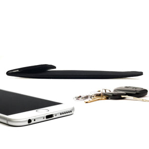 Picture of a Cell phone black canvas X-large privacy protection 4.5 x 6.5 Bag beside a cellphone and keys.