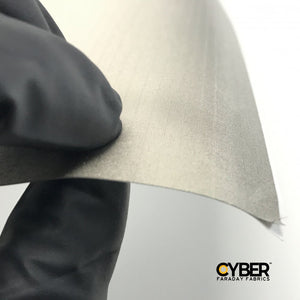 Picture of CYBER Faraday Fabric Adhesive EMF RF Shielding Nickel Copper Rip-Stop Fabric Roll 50″ x 1′ with Cyber faraday fabrics logo on the lower right corner.