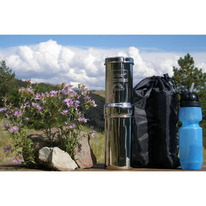 Picture of a Go Berkey Kit – 1 Quart beside a rock and flowers - Water Filtration