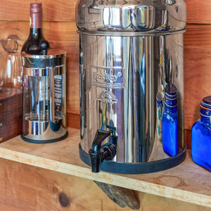Picture of a Travel Berkey® System (1.5 gal) placed in a wood base. - Water Filtration