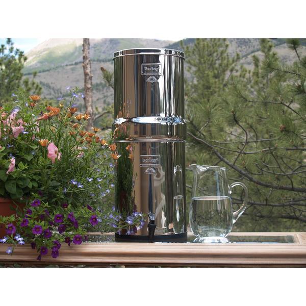 Picture of a IMPERIAL BERKEY® 4.5 GAL WITH 2, 4 OR 6 BLACK ELEMENTS beside a pitcher - Water Filtration